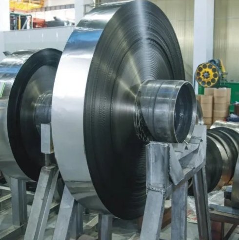 Automated winding machine producing precision amorphous cores